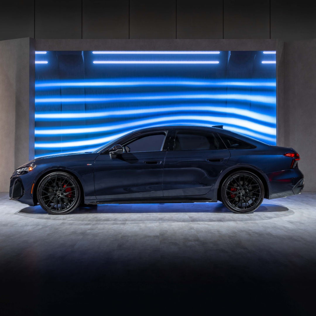 Side profile view of an Audi Sedan.